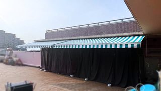 オーニングのシート張替え工事｜青緑×白色のストライプ柄｜神奈川県横浜市